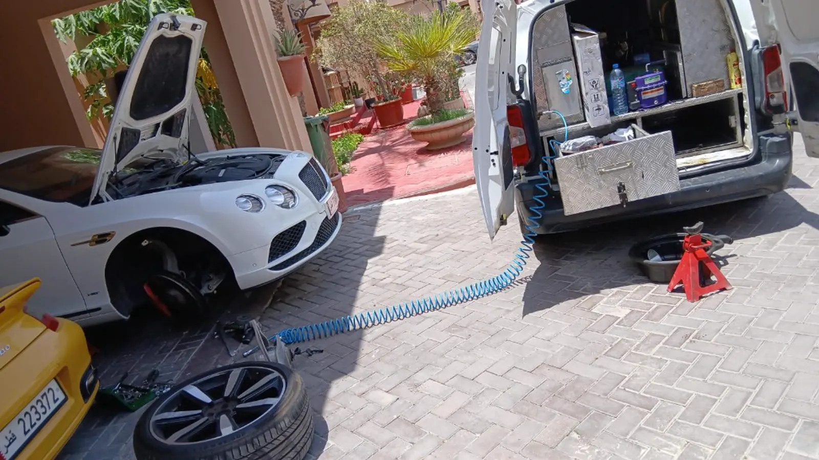 Mobile tire service on a Bentley at the customer driveway in Qatar